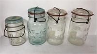 (4) Atlas locking lid jars (3 clear, 1 blue)