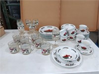 Christmas dishes and glassware.  8 plates 10 in,