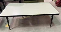 Formica top metal coffee table.  20.5” H x 48” W