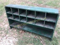 Green painted wooden cubby unit
