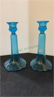 One pair of light blue glass candle sticks - each