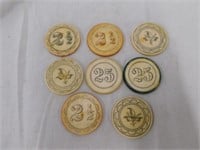 8 Vintage Bakelite poker chips, marked 25 - 2 1/2