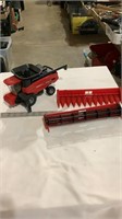 Plastic case tractor with attachments