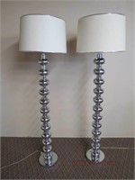 Pair of chrome floor lamps silver lined shades