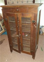 Wood cabinet , two glass doors, on casters