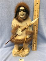 10" fossilized bone carving of an skim hunter, wit