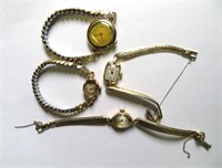 4 lady's wristwatches in 14k gold cases,