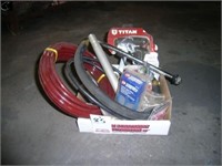 Box of unused paint sprayer hose