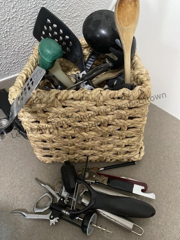 Basket with kitchen utensils, can opener, potato
