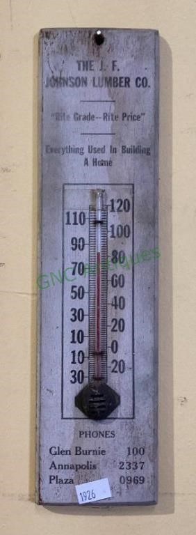Vintage thermometer on a wood back advertising