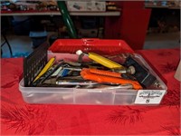 Plastic storage box with assorted hand tools