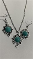 Matching turquoise earrings and pendant set.