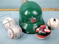 Tin caps helmet and signed baseballs