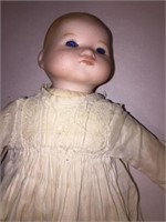BABY DOLL w BLUE EYES, SIGNED ON LOWER PART OF THE