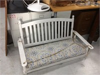 White cushioned porch swing