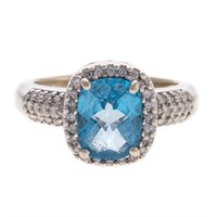 A Lady's Blue Topaz and Diamond Ring in 14K