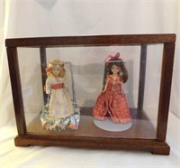 2 vintage sleepy eye dols in wood and plexiglass