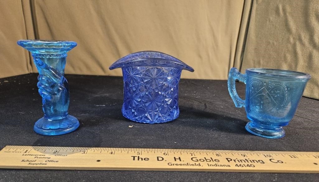 3 pieces of blue glassware