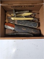 Old cigar box full of antique barber tools