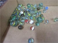 Vintage glass marbles with ribbons.