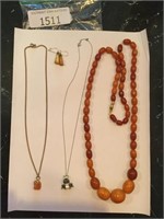 3 necklaces and 1 pair of earrings