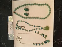 3 necklaces and 1 pair of earrings