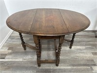 Antique oak drop leaf table with barley