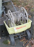 Vigoro 15000 spinner spreader and a hose reel