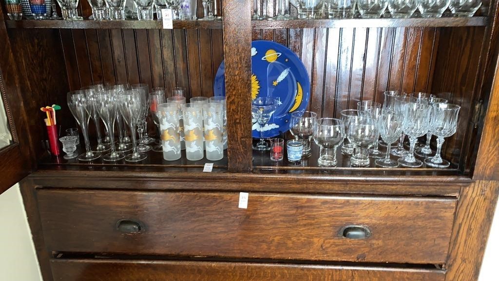 Shelf lot of various glassware, stemware, shot