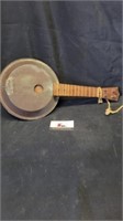 Wooden and tin handmade banjo