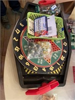 jar of marbles. 8 sets of dice, dart board, chinee