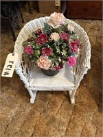 small wicker chair with pot of flowers