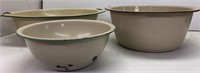 Three beige enamelware bowls