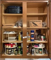 Upper kitchen cabinet with spices, etc.