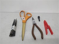lot of tools- wrenches, pliers, scissors, etc.