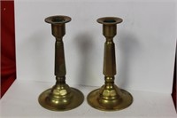 A Pair Of Brass Candlesticks