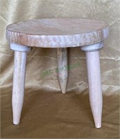 Small three legged oval milking stool/plant