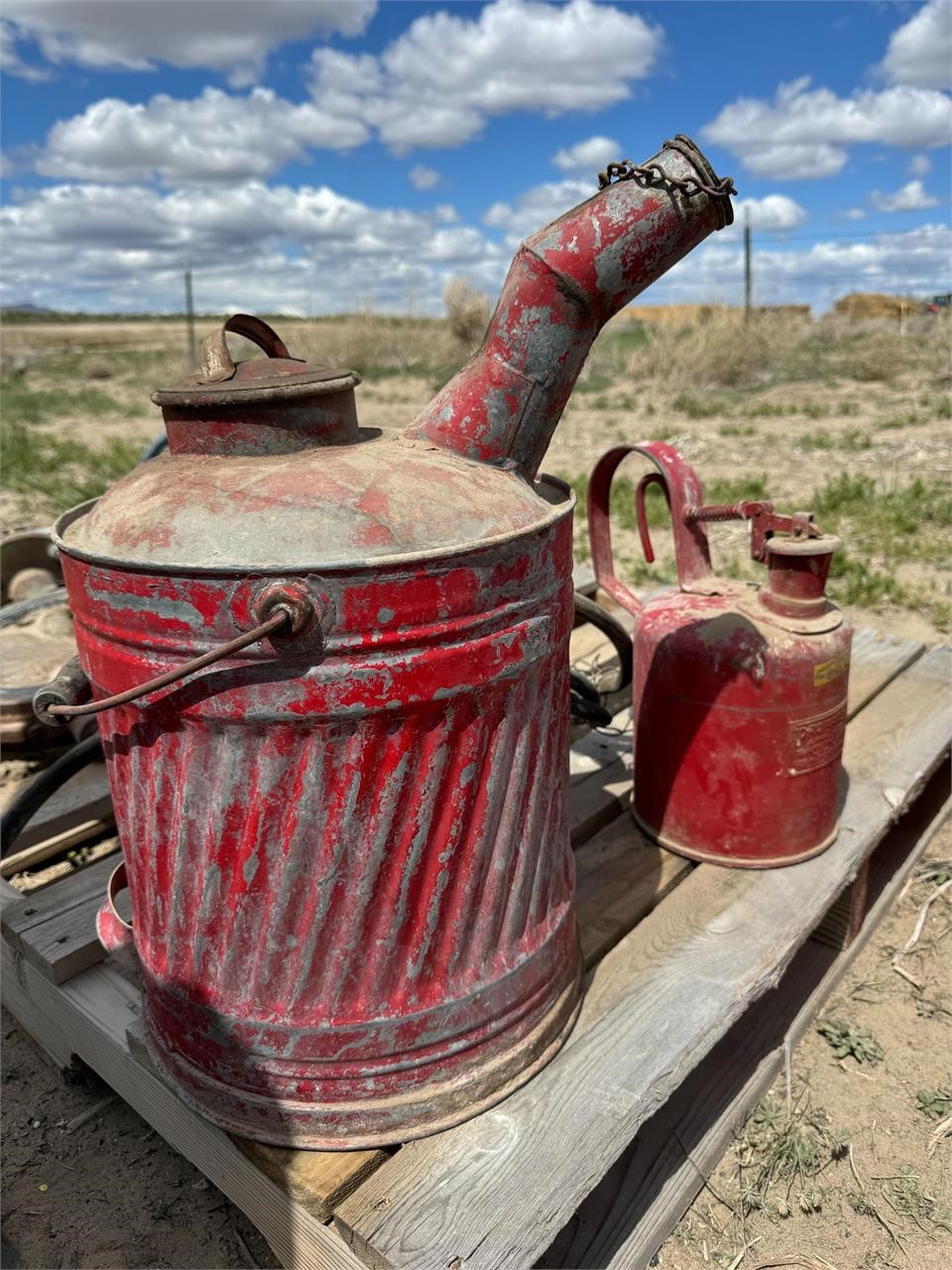 Vintage fuel cans and barrel pump