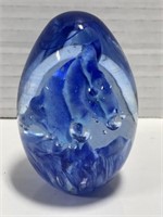 Blue glass oval paperweight, signed