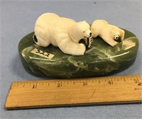 Polar bear and cub ivory carving mounted on a soap