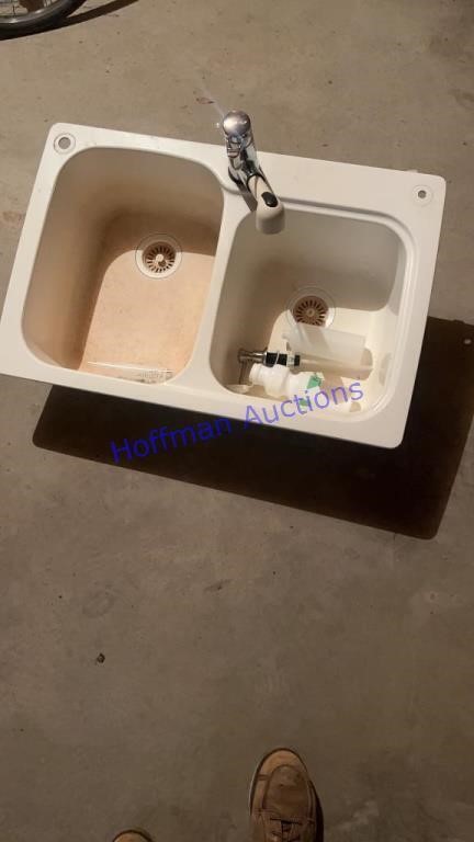 Sink with faucet and soap dispenser