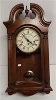 Vintage Howard Miller wall clock with key. Runs