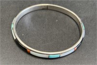 Sterling marked bangle with stones
