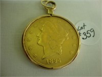 1894 20 Dollar gold piece in a 14 kt bezel.