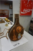 unusual leather bottle from Uruguay with coin