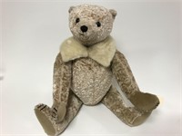 Jointed teddy bear with fur collar