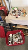 Tote full of Christmas figurines plate cup and