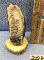 2 3/4" tall fossilized walrus tooth, mounted on an