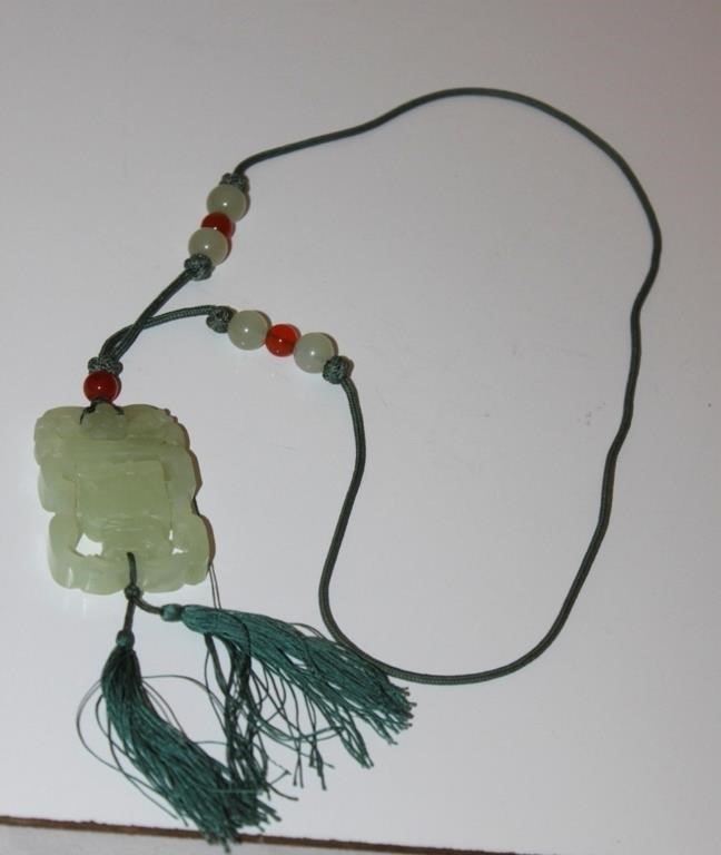 A Chinese Jade / Hardstone Movable Pendant
