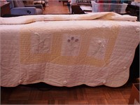 Contemporary quilt with hand crocheted applique